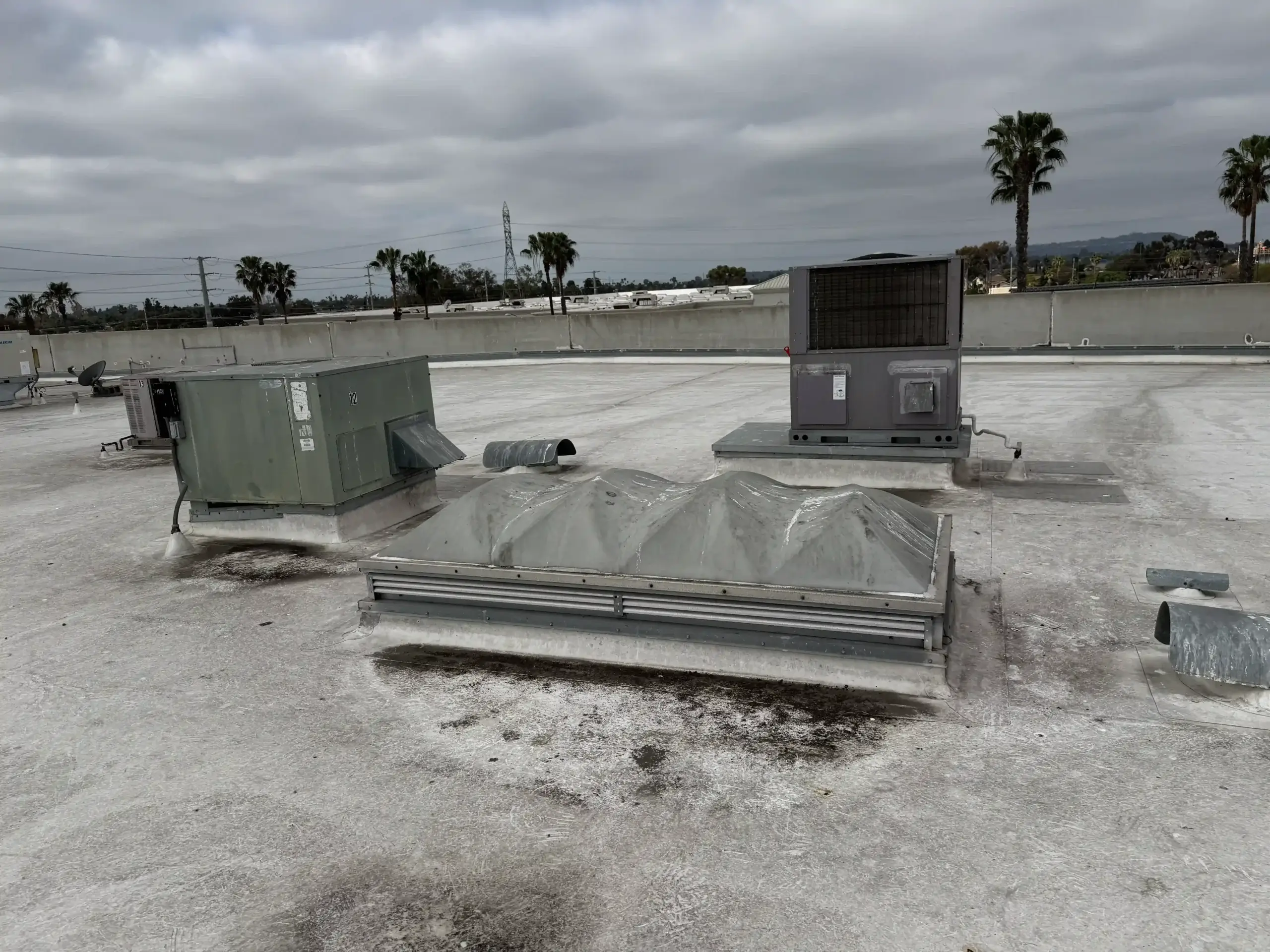 Multiple rooftop HVAC units and skylight - industrial facility - San Diego